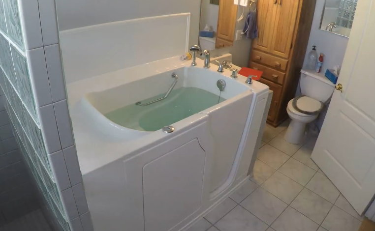 Bathroom after a complete Walk-in tub install, the tub was fill up with water and ready to turn on the spa function. 